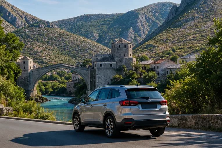 A rental car on a sunny road through Herzegovina's rugged valley near Mostar
