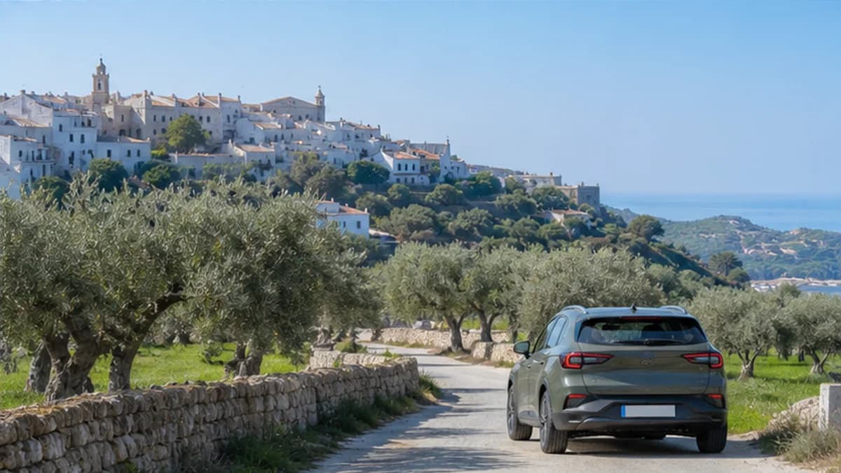 Rental car beside whitewashed villages and olive groves near Bari in Puglia
