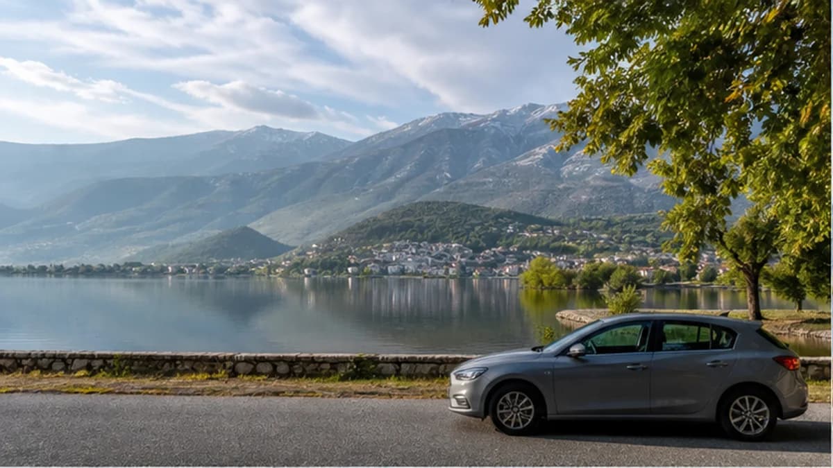 Rental car beside Lake Pamvotis and the Epirus mountains near Ioannina