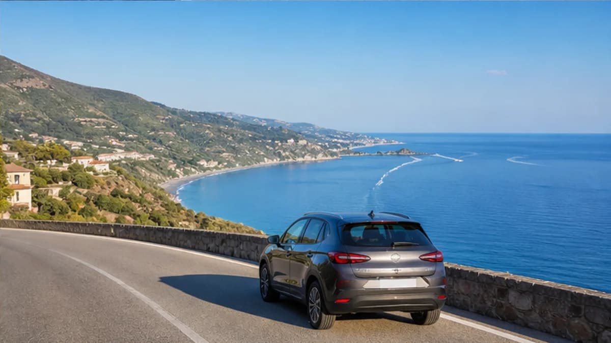 Rental car on a dramatic Calabrian coastal road near Lamezia Terme