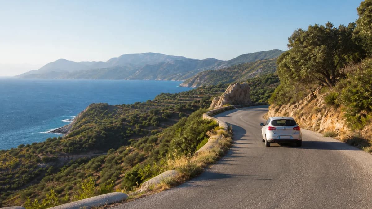 Rental car on a coastal road near Samos Airport, Greece