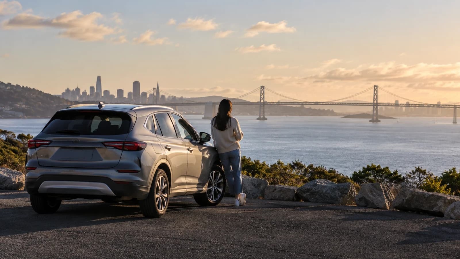 Illustration of an unbranded rental car beside San Francisco Bay viewed from Oakland.