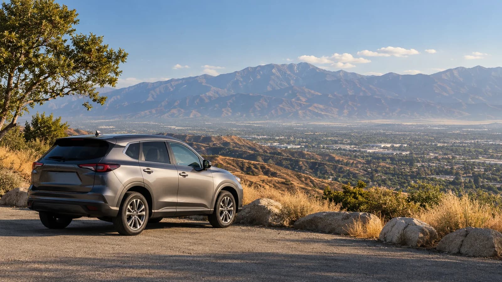 Illustration of an unbranded rental car above the Inland Empire with Southern California mountains beyond.