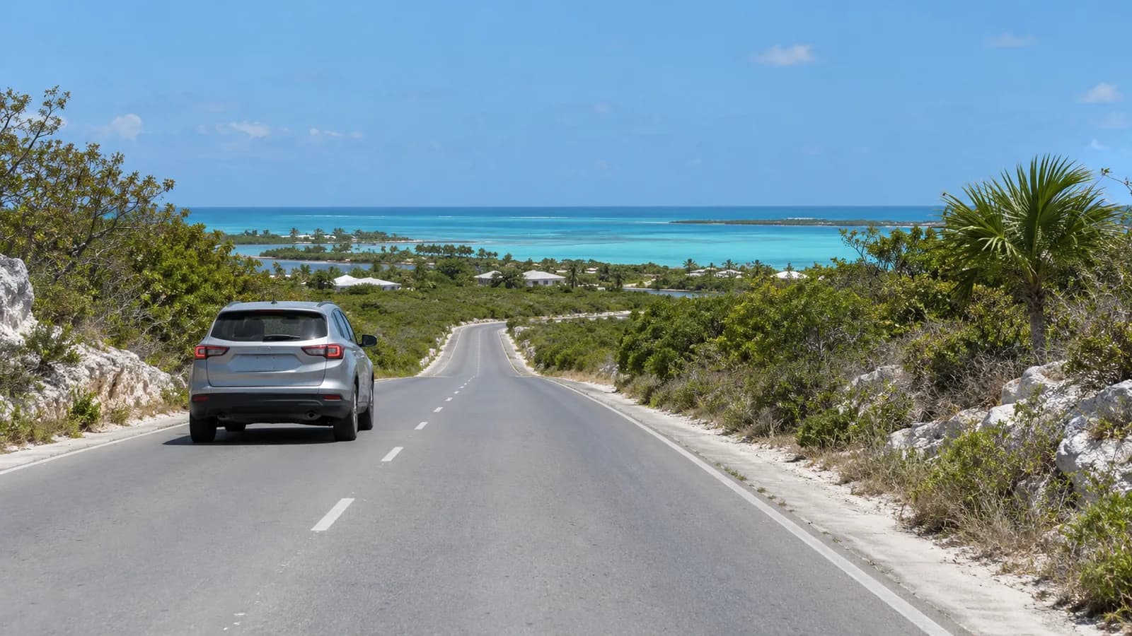 Providenciales Airport car rental illustration of an unbranded SUV on a Turks and Caicos island road.