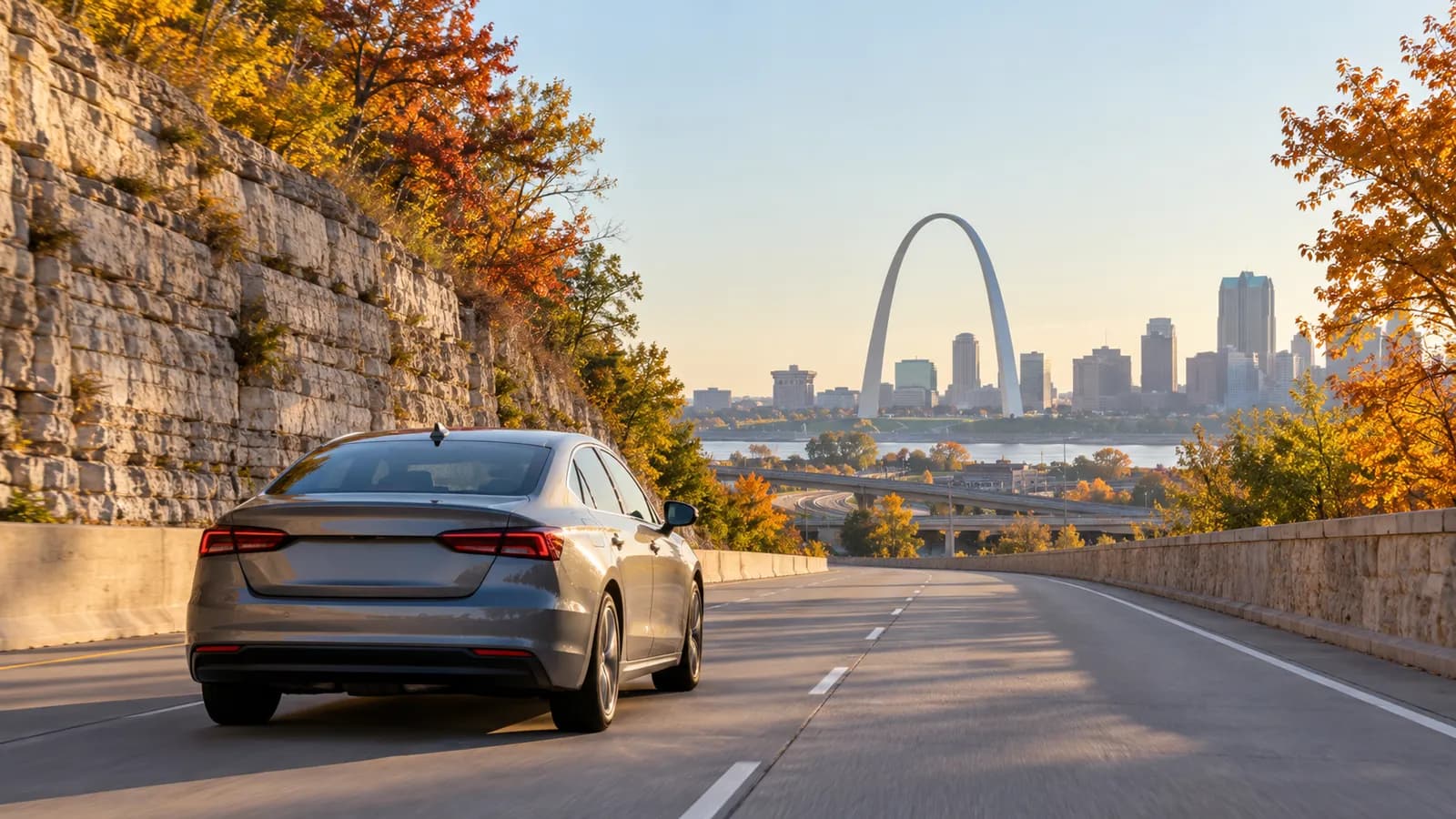 St Louis rental car illustration with an unbranded car and a distant Gateway Arch.